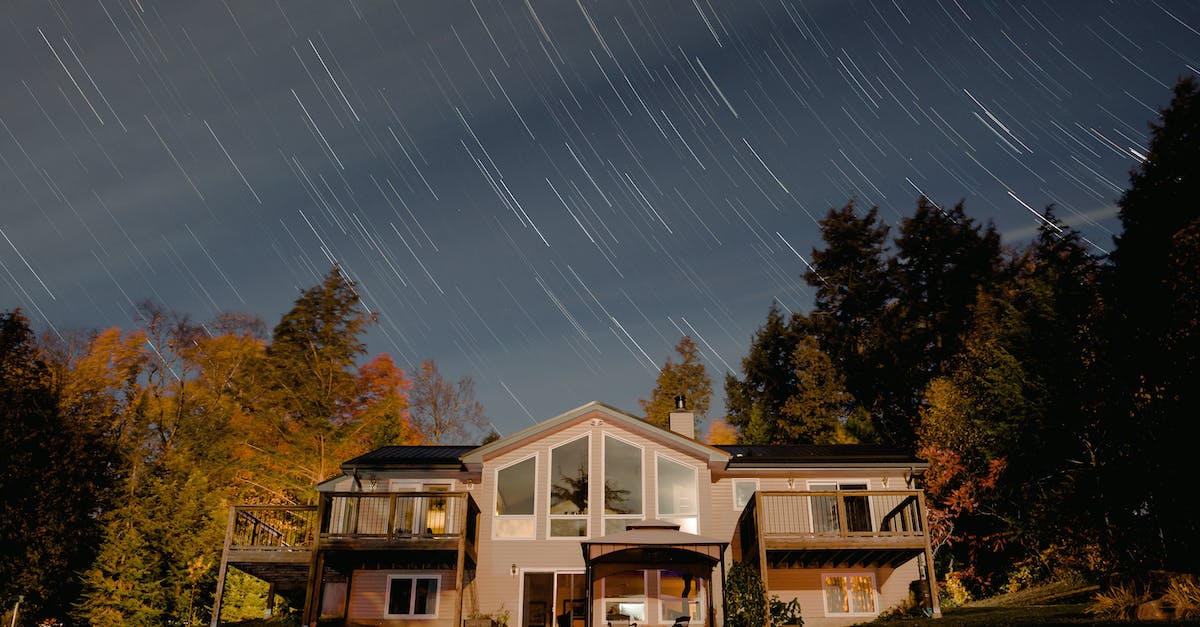 How to open illusory walls with messages in front of it? - White and Brown Wooden House