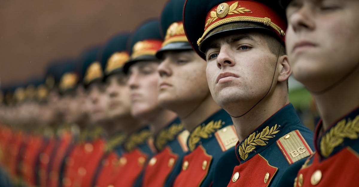 How to order your troops to guard a particular place? - Men in Black and Red Cade Hats and Military Uniform