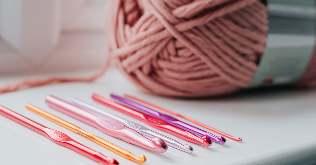 How to overcome 'Differing war philosophy' to create an alliance in Stellaris? - Closeup of row of multicolored crochet needles and ball of beige threads for knitting in bright room