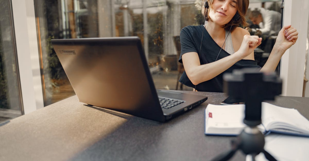 How to play FIFA on a basic laptop without over-heating the laptop? [closed] - Woman having fun while sitting with laptop