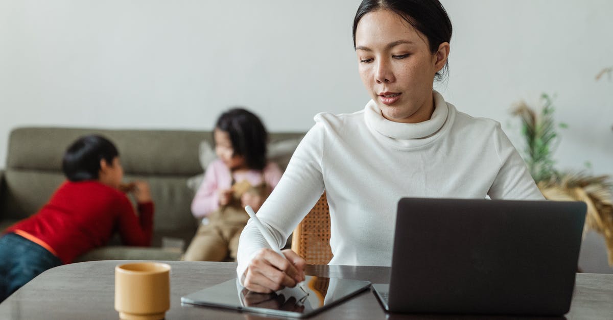 How to play Project M using a backup on USB? - Focused young Asian woman in casual wear writing with stylus on tablet and browsing laptop while working remotely at home with children How to play Project M using a backup on USB? - Focused young Asian woman in casual wear writing with stylus on tablet and browsing laptop while working remotely at home with children
