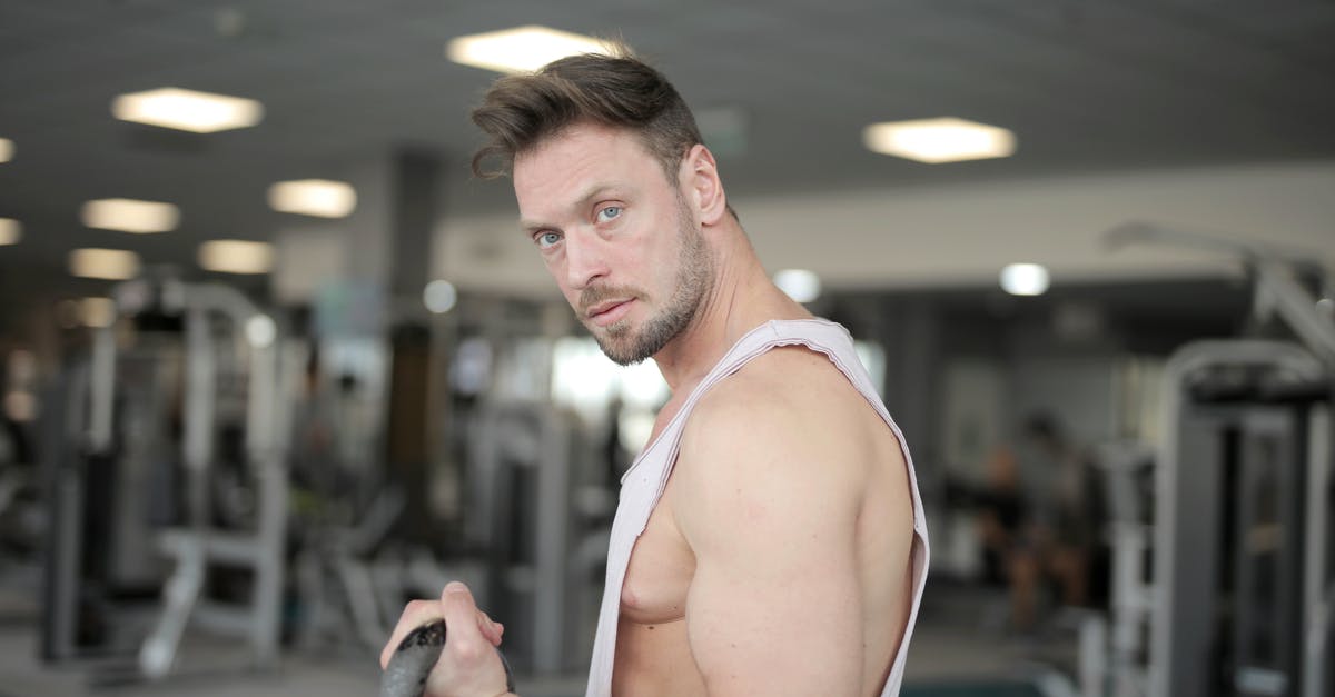 How to power a 200 z level pump stack - Strong confident sportsman holding kettlebell in hand while training in gym and looking at camera How to power a 200 z level pump stack - Strong confident sportsman holding kettlebell in hand while training in gym and looking at camera