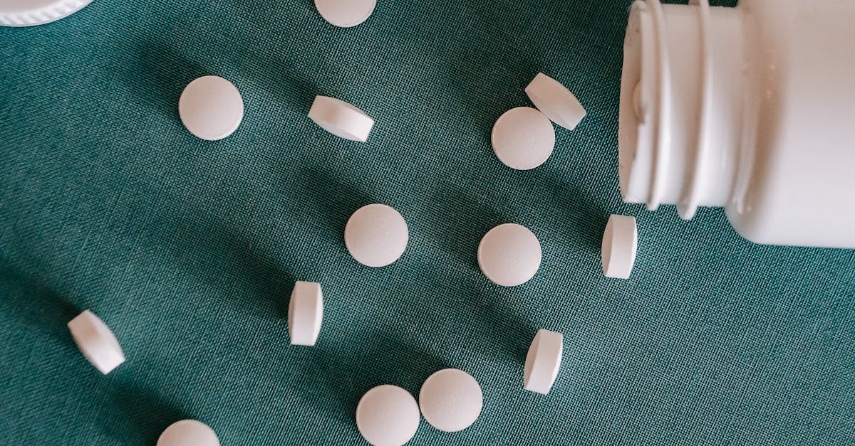 How to prevent being stunned by the first form of Vol Opt? - Top view of similar small round white pills spilled from plastic container on green surface How to prevent being stunned by the first form of Vol Opt? - Top view of similar small round white pills spilled from plastic container on green surface