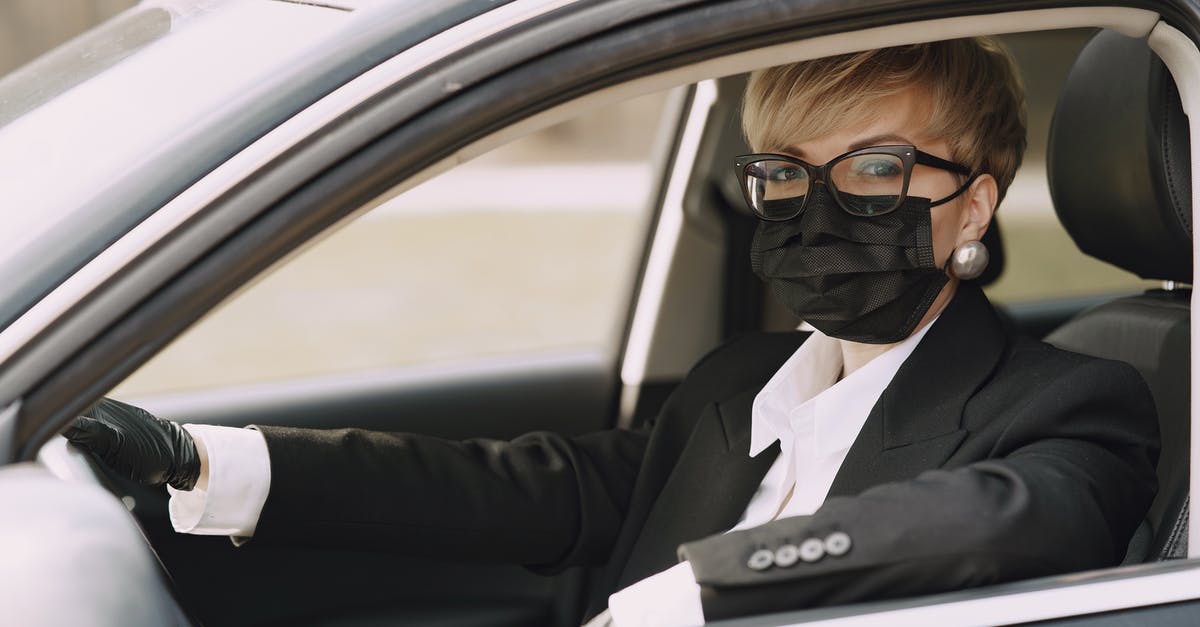 How to prevent camera Y axis to invert when inside a vehicle? - Serious female driver in protective mask and gloves in car