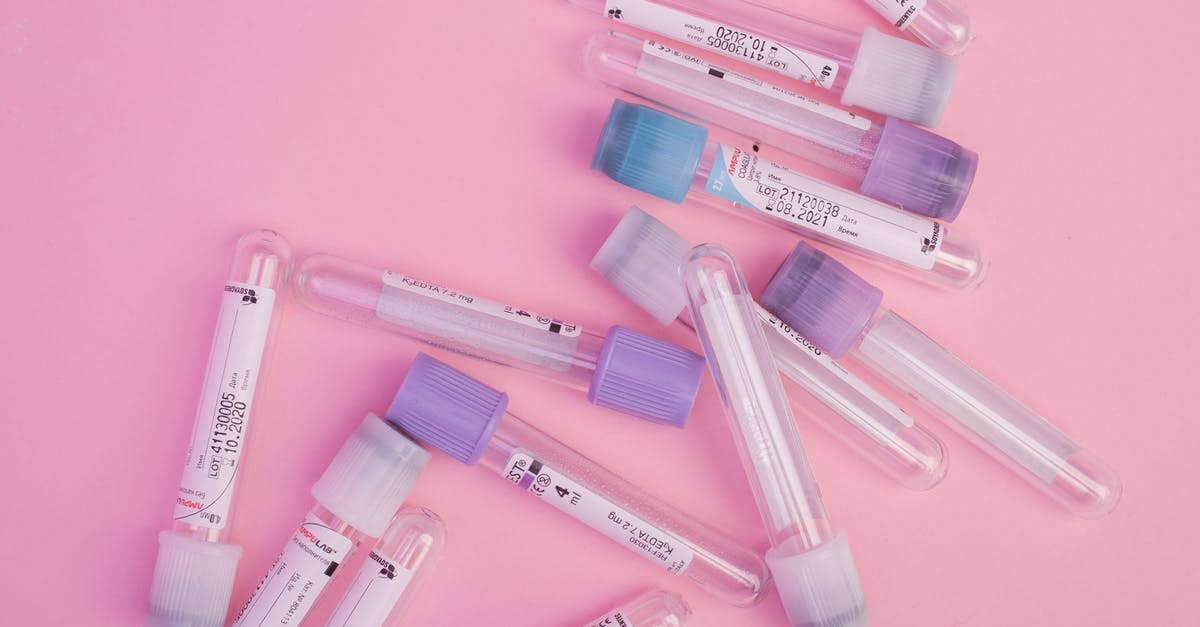 How to prevent falling mobs stopping my collection minecart in its tracks? - Set of blood test vials arranged on pink table