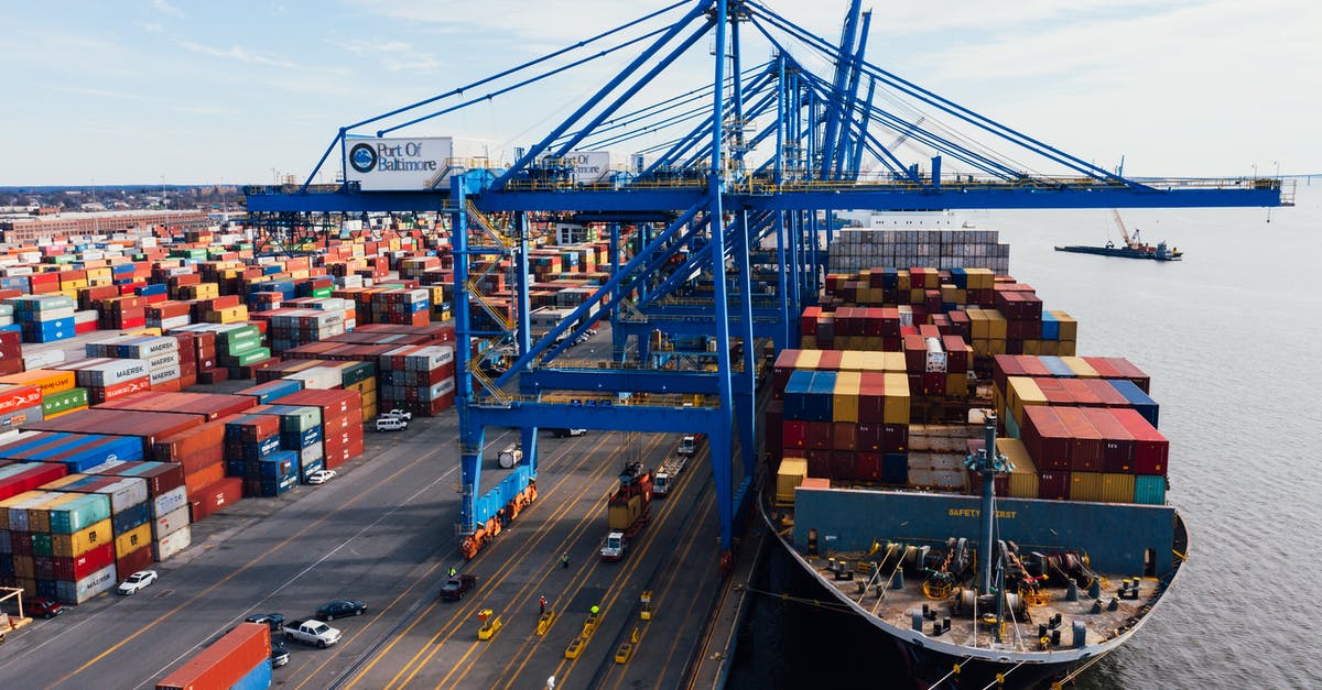 How to prevent slimes from spawning in a large area - Cargo ship unloading colorful containers in port How to prevent slimes from spawning in a large area - Cargo ship unloading colorful containers in port