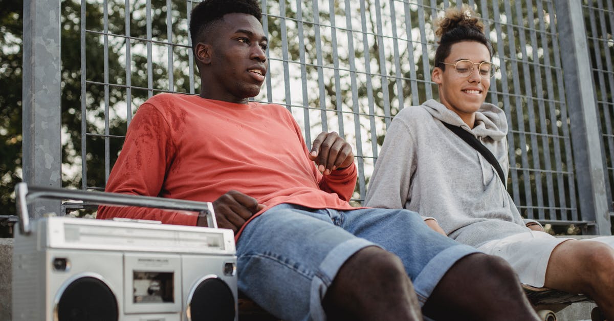 How to prevent the closest player from breaking blocks? - Positive multiethnic friends sitting on skateboards in skate park How to prevent the closest player from breaking blocks? - Positive multiethnic friends sitting on skateboards in skate park