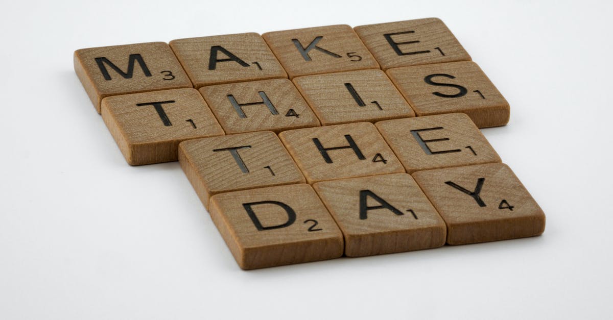 How to pronounce "Pate" for the megaphone? - Brown Wooden Blocks on White Table