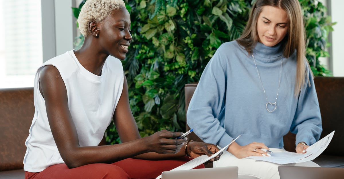 How to read system requirements & compare GPUs? - Multiracial colleagues checking important report on papers