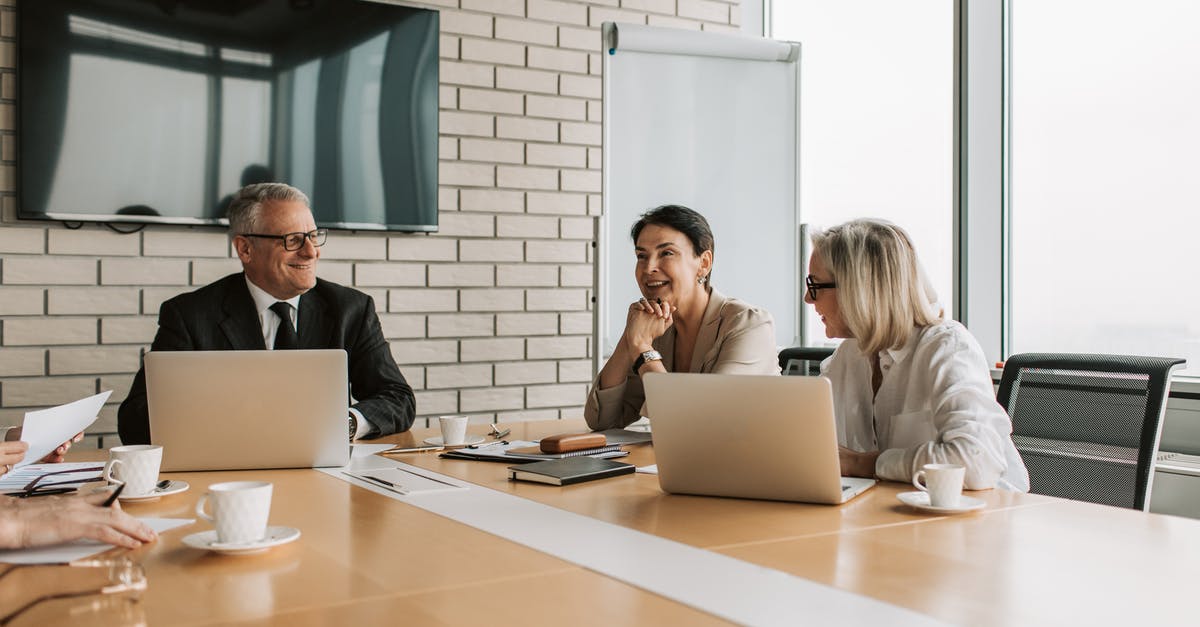 How to reapply for work permit? - Man in Black Framed Eyeglasses and White Dress Shirt Sitting Beside Woman in White Long Sleeve How to reapply for work permit? - Man in Black Framed Eyeglasses and White Dress Shirt Sitting Beside Woman in White Long Sleeve