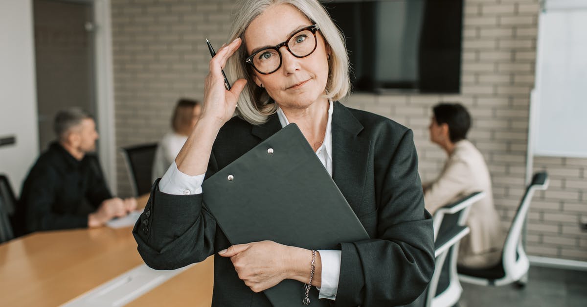 How to reapply for work permit? - Woman in Black Blazer Holding Black Tablet Computer How to reapply for work permit? - Woman in Black Blazer Holding Black Tablet Computer