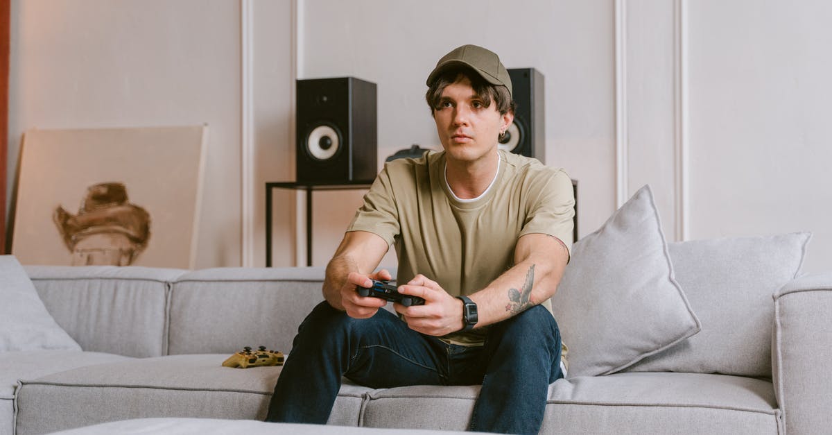 How to re-enable intro videos? - Man in Brown Crew Neck T-shirt and Blue Denim Jeans Sitting on White Couch How to re-enable intro videos? - Man in Brown Crew Neck T-shirt and Blue Denim Jeans Sitting on White Couch