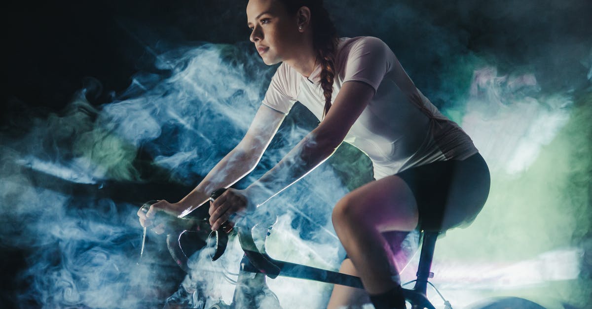 How to remove active effect in skyrim? - Young female athlete in active wear with concentrated gaze riding bicycle in shiny cloud while looking forward