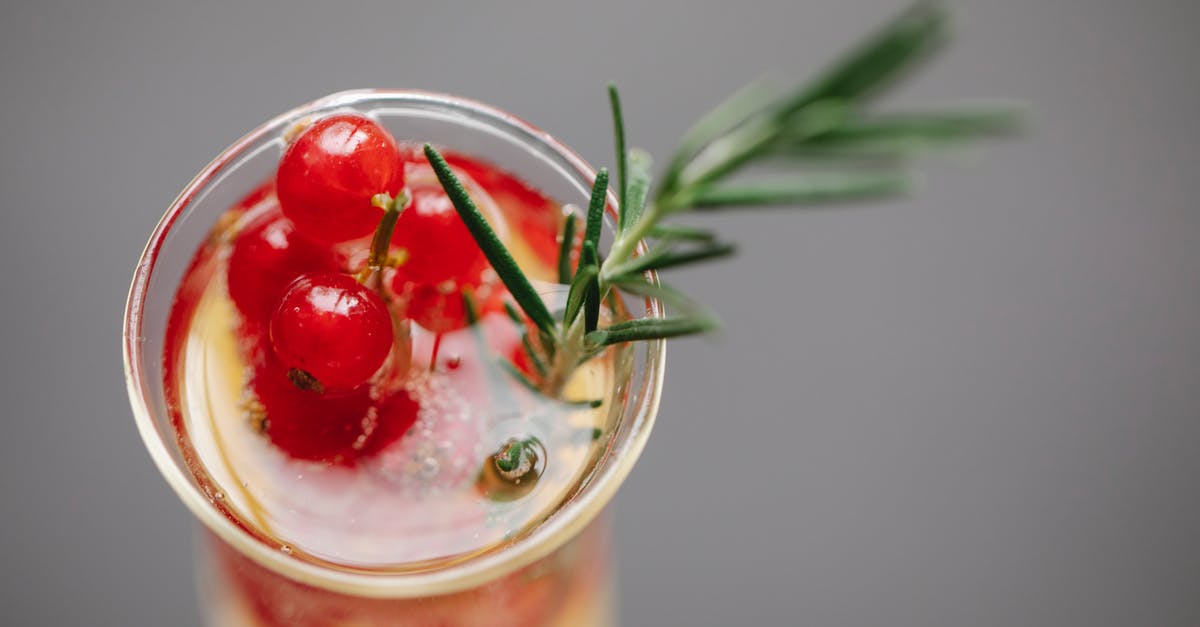 How to remove translucent gray bar across world - High angle of transparent glass filled with champagne served with fresh red currant and rosemary How to remove translucent gray bar across world - High angle of transparent glass filled with champagne served with fresh red currant and rosemary
