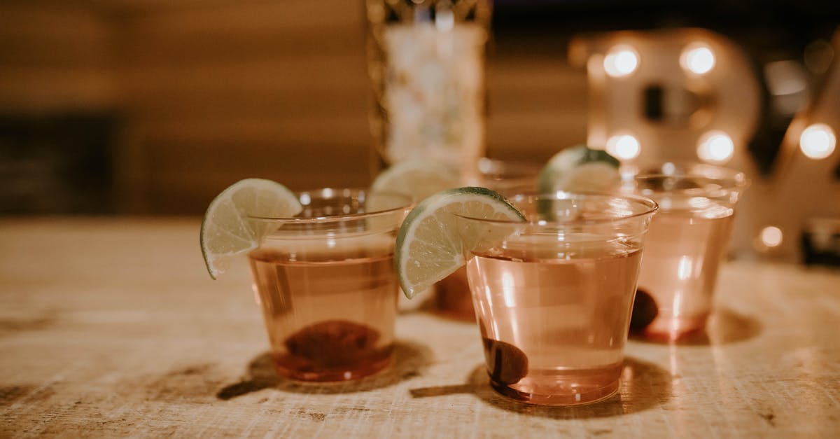How to remove translucent gray bar across world - Glasses of tequila with lime and olives How to remove translucent gray bar across world - Glasses of tequila with lime and olives
