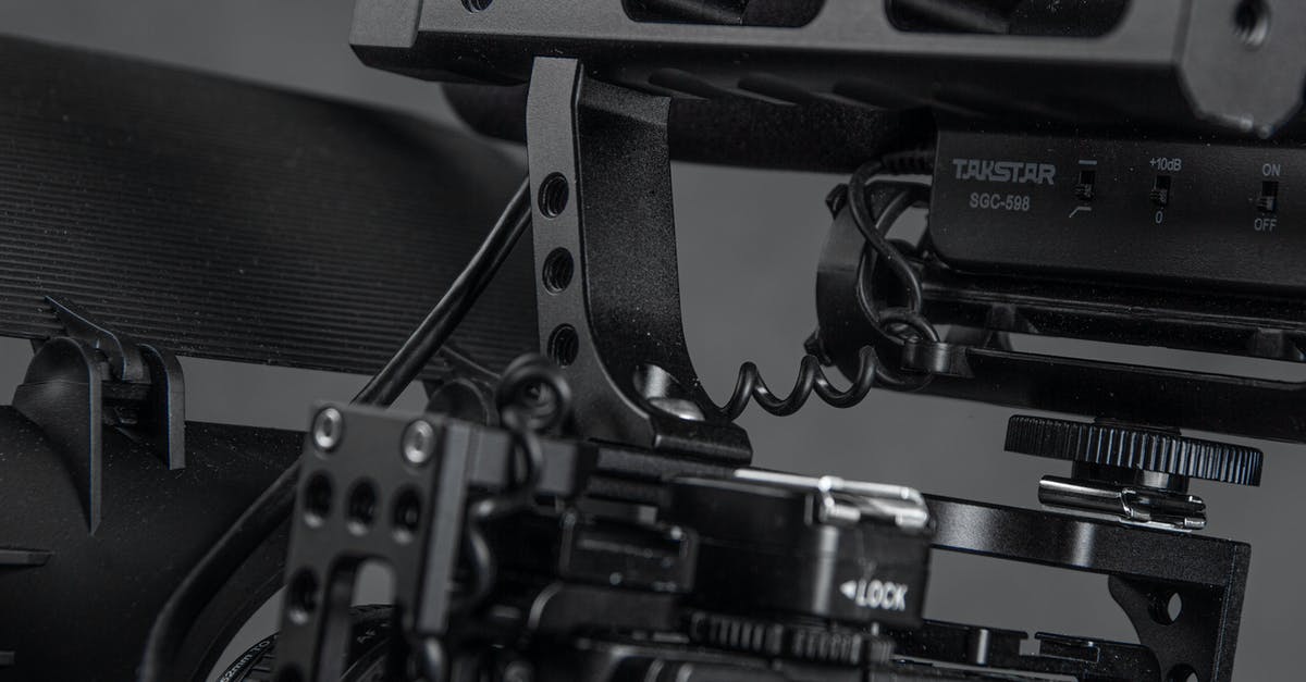 How to review a video fragment in XCOM2 - Detail of modern black professional video camera cage with wires and steel construction placed on gray background in contemporary studio