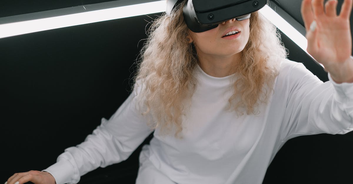 How to run Battle Simulator - Woman in White Long Sleeve Shirt Wearing Black Headphones