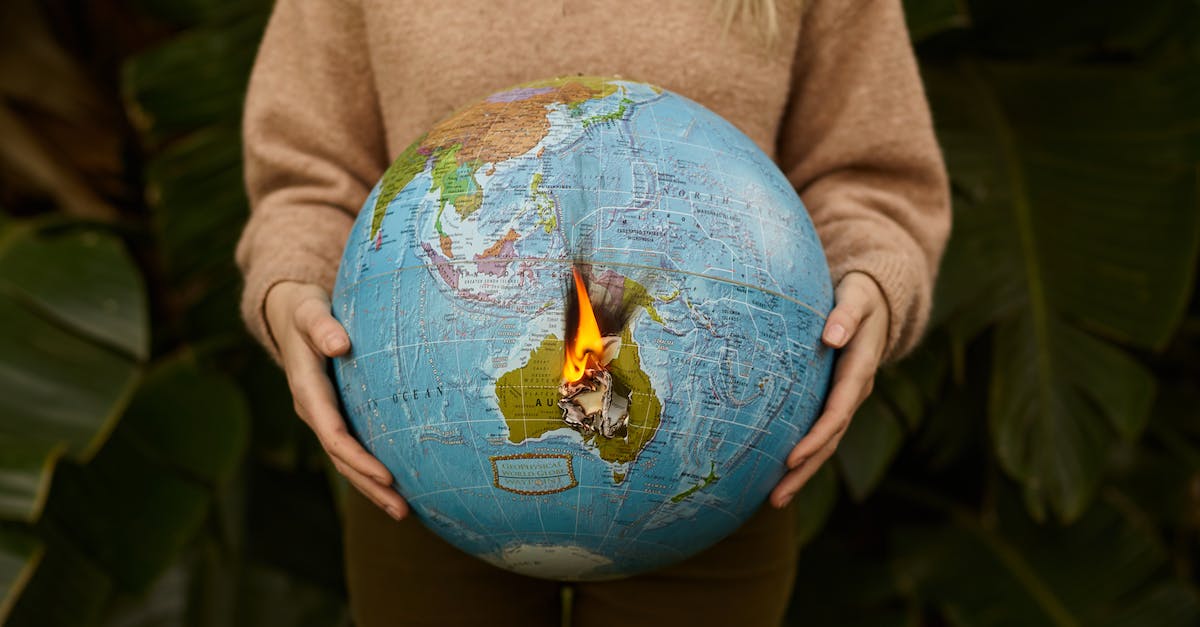 How to save the life of Silus Vesuius? - Crop woman with burning globe in hands How to save the life of Silus Vesuius? - Crop woman with burning globe in hands