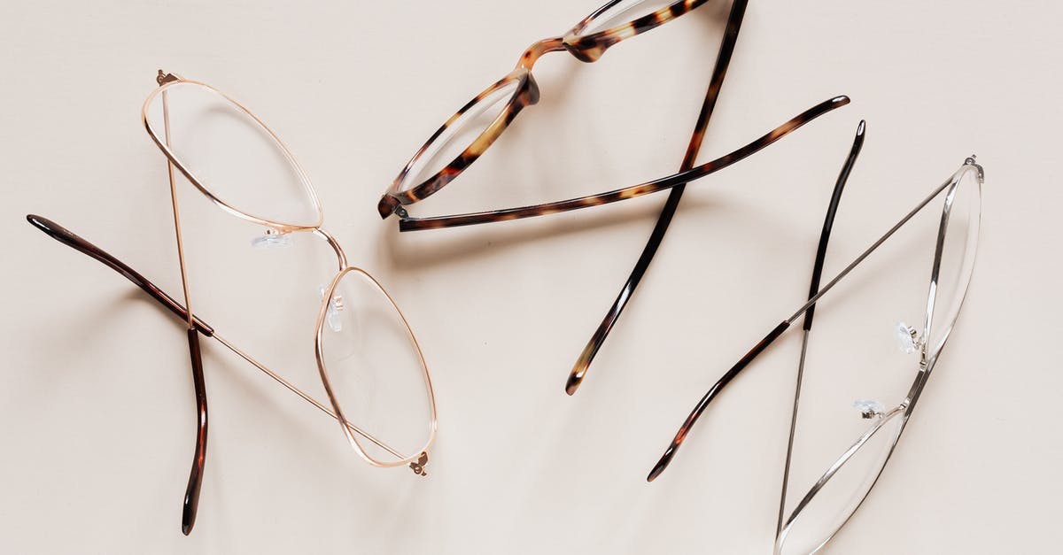 How to see past war table missions? - From above of fashion glasses with optical lenses for vision correction in metal shells together with pair in plastic tortoise shell placed on white table
