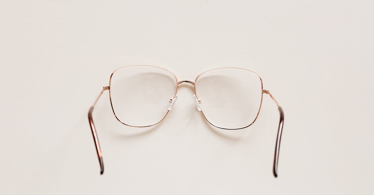 How to see past war table missions? - Top view of fashion spectacles with transparent optical lenses in golden metal shell placed on white table How to see past war table missions? - Top view of fashion spectacles with transparent optical lenses in golden metal shell placed on white table