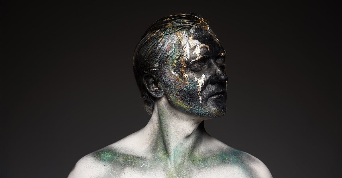 How to select character model in creation? - Male shirtless model with glowing glitters on black painted face covering eyes standing on black backdrop How to select character model in creation? - Male shirtless model with glowing glitters on black painted face covering eyes standing on black backdrop