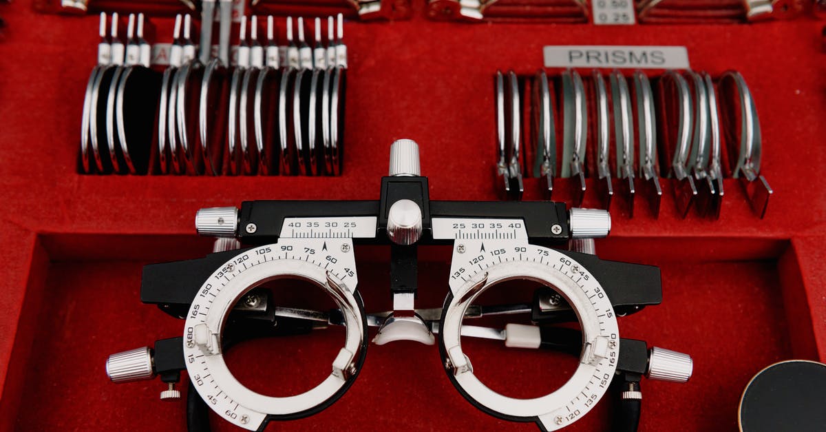 How to set correct country? - High angle collection of various trial lenses and frame placed in red holder in ophthalmology clinic