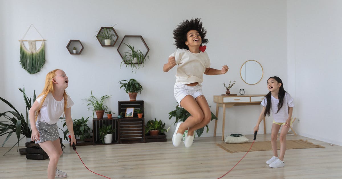 How to skip levels in untrusted - Black girl jumping over rope while playing with friends