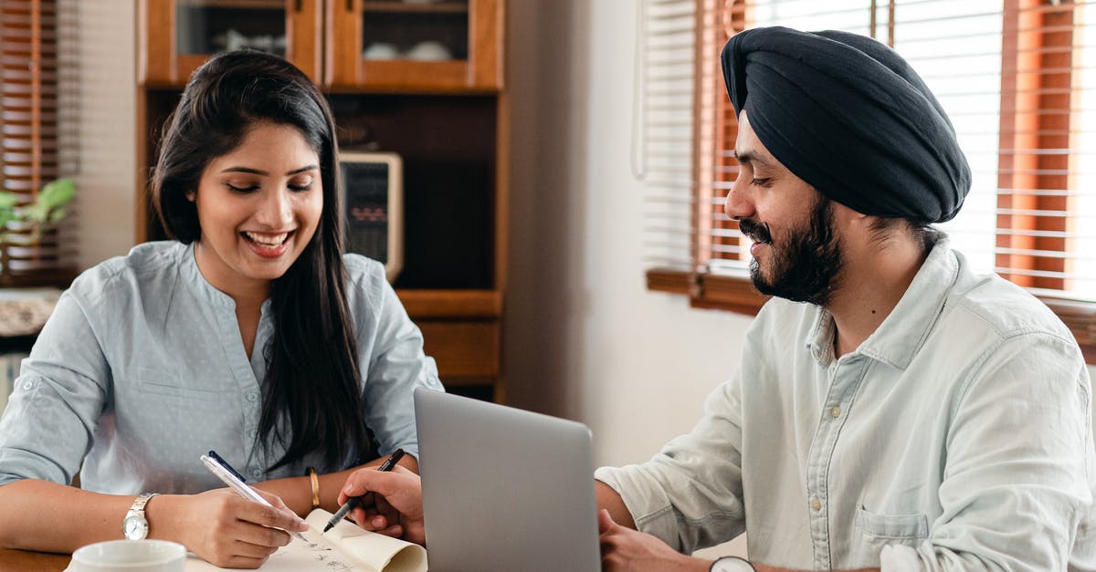 How to solve the "io.netty.channel.AbstractChannel$AnnotatedConnectException: Connection refused: no further information" error on Minecraft? - Happy Indian couple using laptop while doing homework together