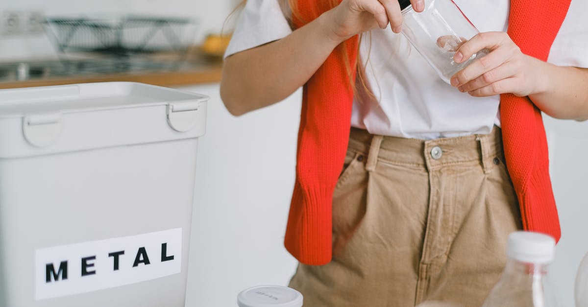 How to sort different output (like Plastic and Waste)? - Woman unscrewing lid from bottle while sorting trash How to sort different output (like Plastic and Waste)? - Woman unscrewing lid from bottle while sorting trash