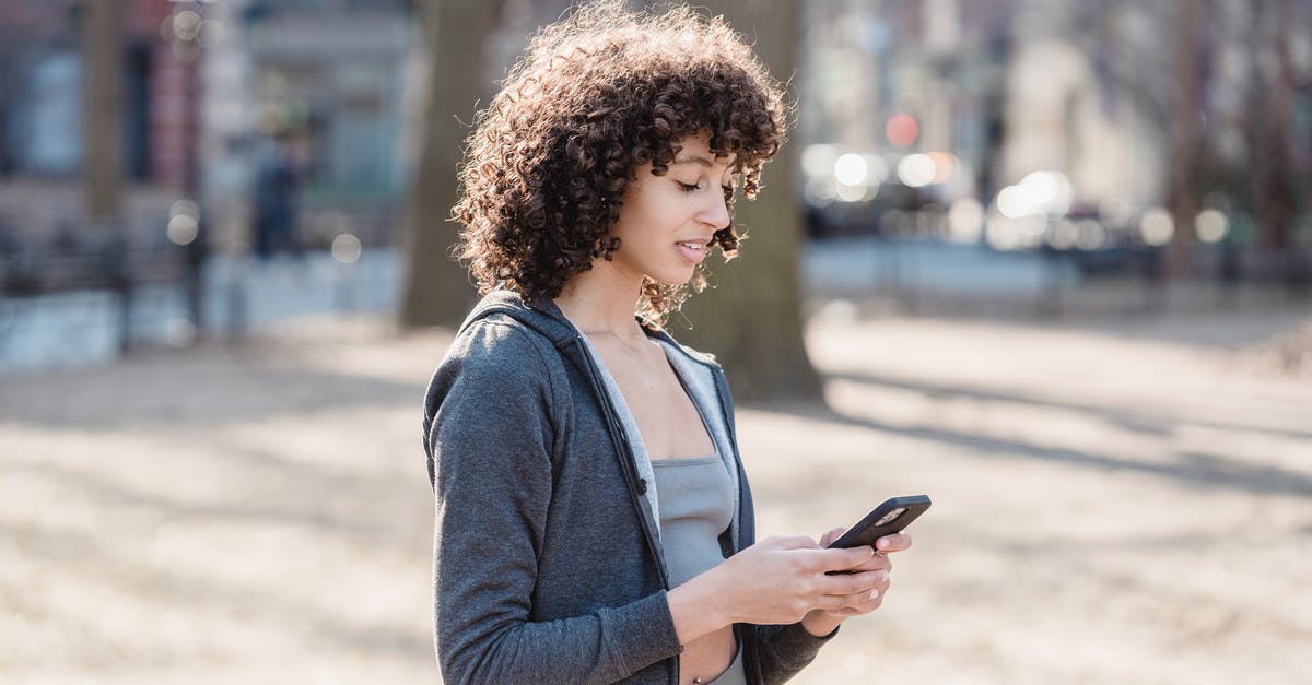 How to specifically send either a chat message to all players or only allies? [duplicate] - Black woman using smartphone for sms in park