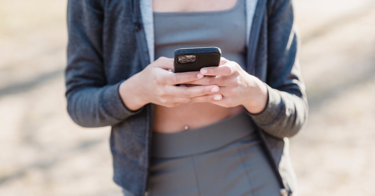 How to specifically send either a chat message to all players or only allies? [duplicate] - Crop unrecognizable woman in gray clothes texting message against blurred background while standing outside