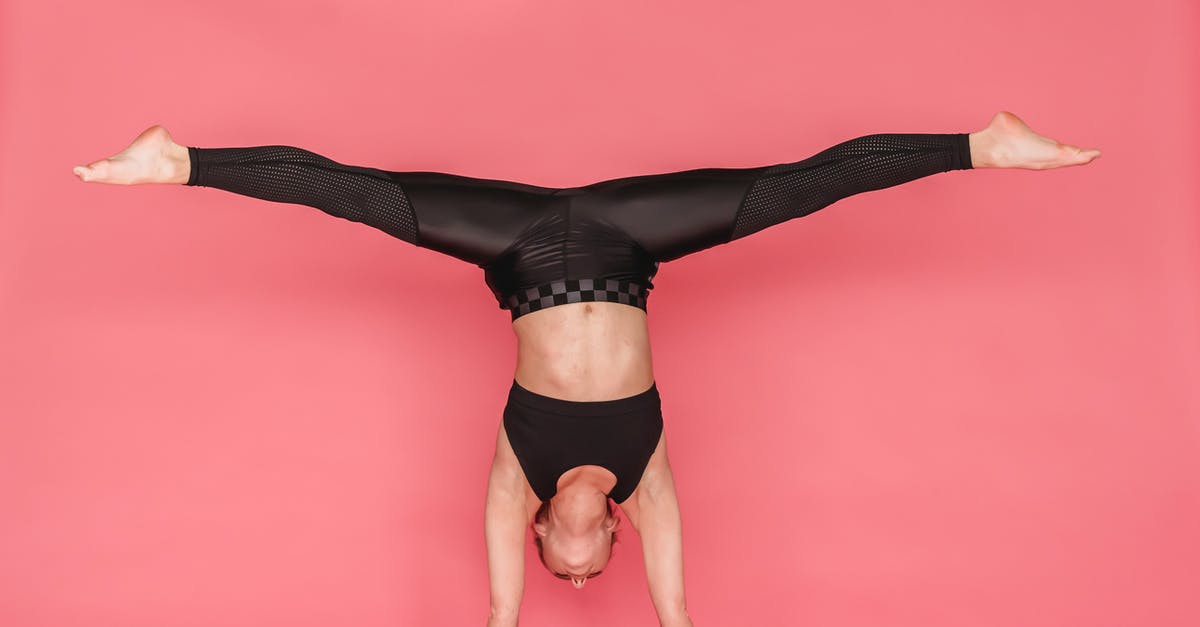 How to split in Mitos.is - Flexible woman stretching legs while standing on hands How to split in Mitos.is - Flexible woman stretching legs while standing on hands