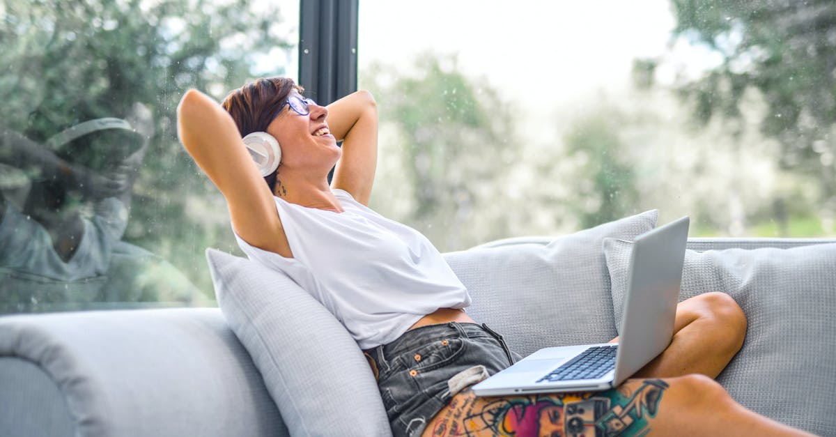 How to stop FEH from pausing my music when turning on - Woman Sitting on Couch