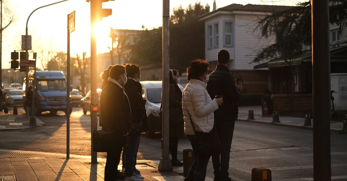 How to stop people from settling in our area? - People standing near crosswalk in city