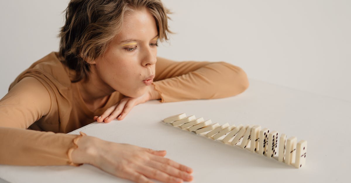 How to stop some games blowing fuse - Woman in Brown Long Sleeve Shirt Leaning on White Table