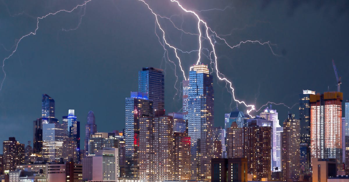 How to summon lightning bolt at normal (and not charged) creepers only? - City Lit Up at Night
