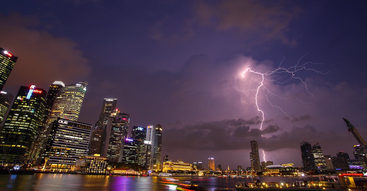 How to summon lightning bolt at normal (and not charged) creepers only? - Lightning and Skyline Photo of Cityscape
