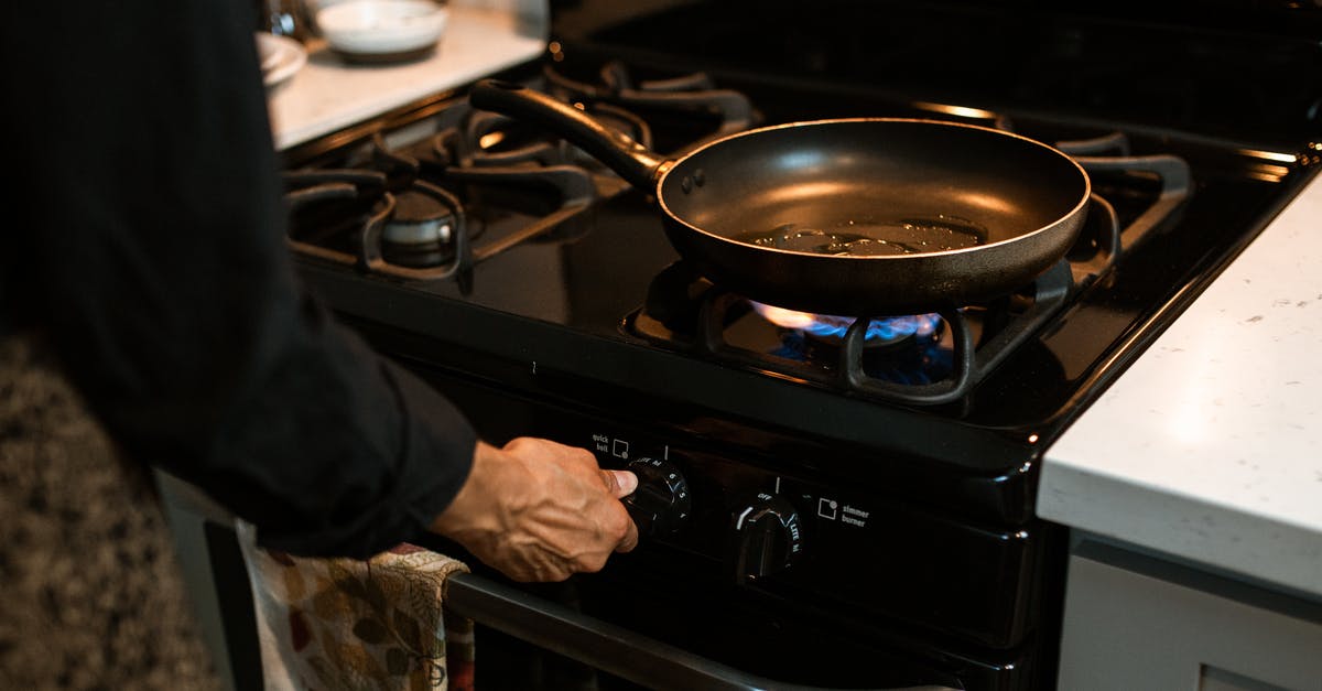 How to switch multi-tool modes and reload the Bolt Caster? - Crop faceless woman adjusting rotary switch of stove
