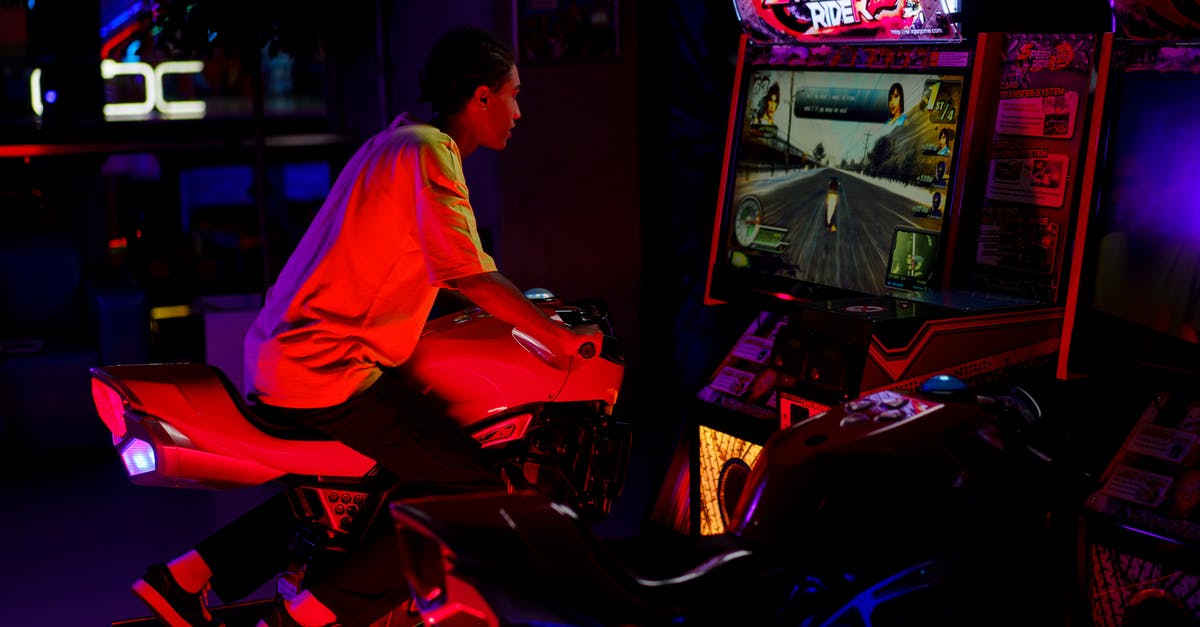 How to tag all snowballs that aren't riding another entity? - Man in Yellow Crew Neck T-Shirt Riding a Motorcycle Arcade Game 