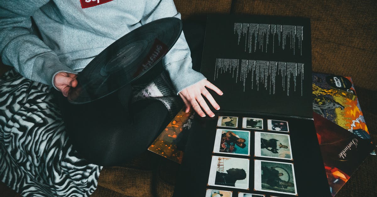 How to take screenshots of the old games - From above of crop unrecognizable person in casual clothes sitting on sofa and taking vinyl record at home in daytime How to take screenshots of the old games - From above of crop unrecognizable person in casual clothes sitting on sofa and taking vinyl record at home in daytime