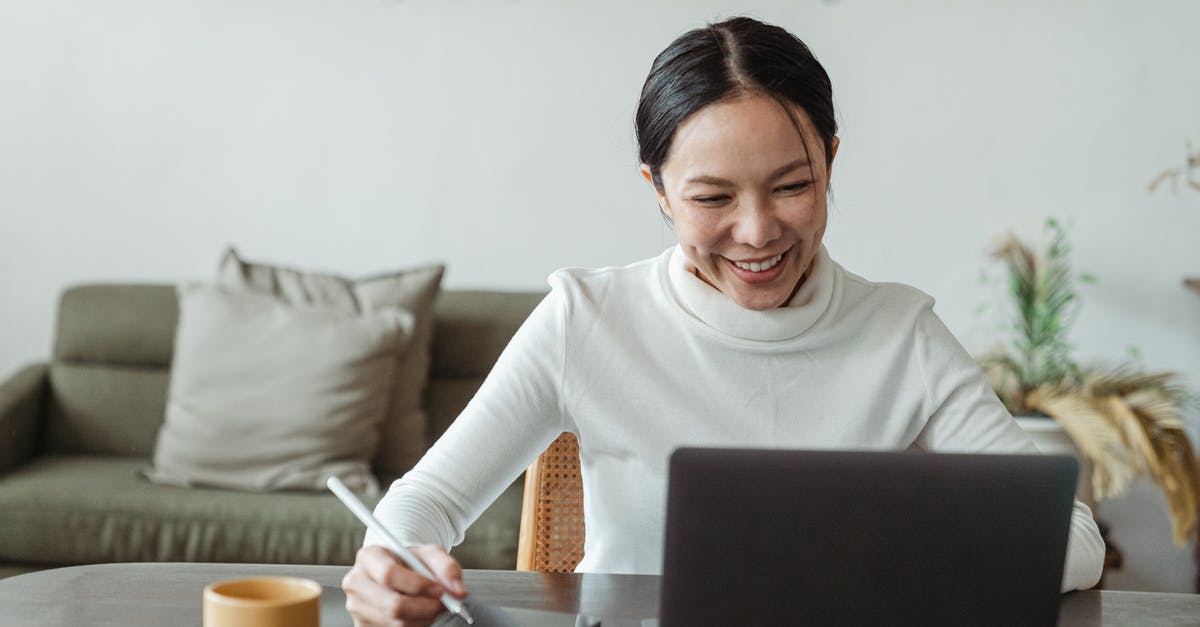 How to talk to the living? - Woman working at home and making video call on laptop How to talk to the living? - Woman working at home and making video call on laptop