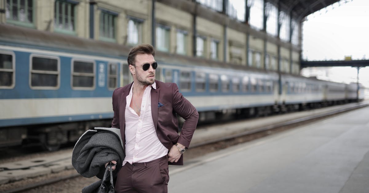 How to target a train summoned via TrainCarts plugin and then /entitydata to set its passenger(Armor Stand) - Confident trendy male traveler standing on railroad platform with coat and travel bag How to target a train summoned via TrainCarts plugin and then /entitydata to set its passenger(Armor Stand) - Confident trendy male traveler standing on railroad platform with coat and travel bag
