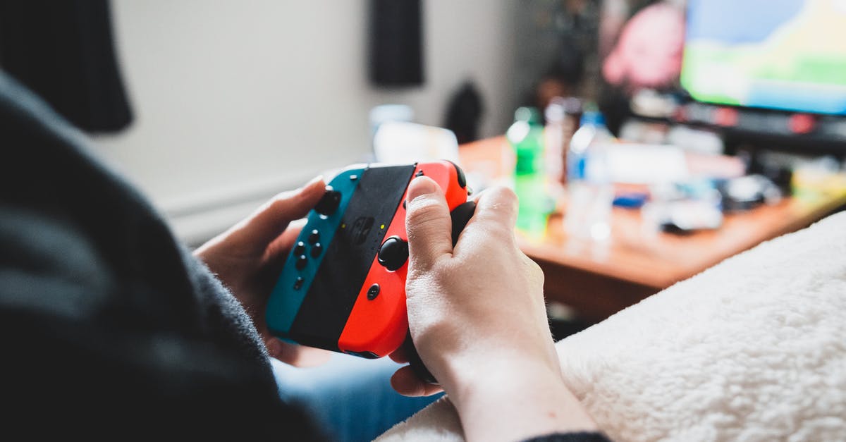 How to teleport a player who activates a command block without using @p? - Crop unrecognizable person using console in hands while playing videogame on blurred background