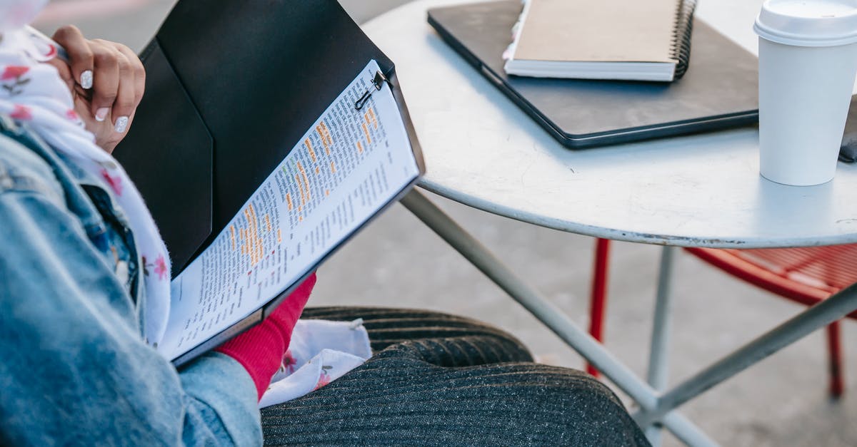 How to tell if someone is cheating and report them in pokémon go? - Student sitting at table and reading report in folder in daytime How to tell if someone is cheating and report them in pokémon go? - Student sitting at table and reading report in folder in daytime