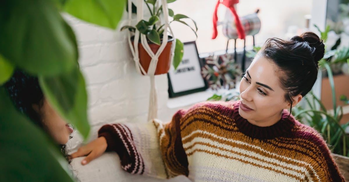 How to tell who lives in a Cell - From above of young female in casual clothes sitting on comfortable couch and talking to friend while resting in cozy room How to tell who lives in a Cell - From above of young female in casual clothes sitting on comfortable couch and talking to friend while resting in cozy room