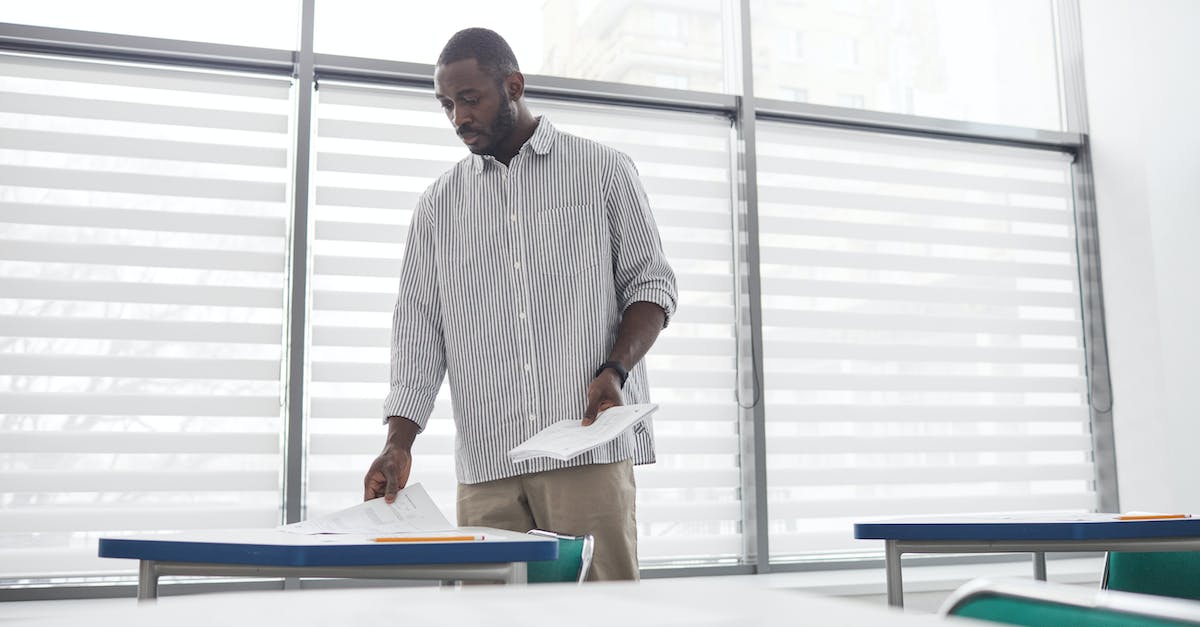 How to test for people standing on a specific block? - A Low Angle Shot of a Man Putting Test Paper on the Table How to test for people standing on a specific block? - A Low Angle Shot of a Man Putting Test Paper on the Table