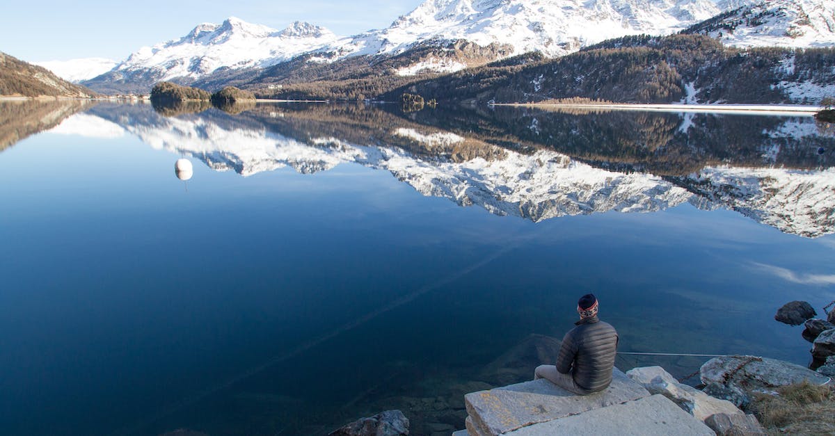 How to testfor blocks not people - Man Sitting at the Edge of Rock Facing the Lake during Day