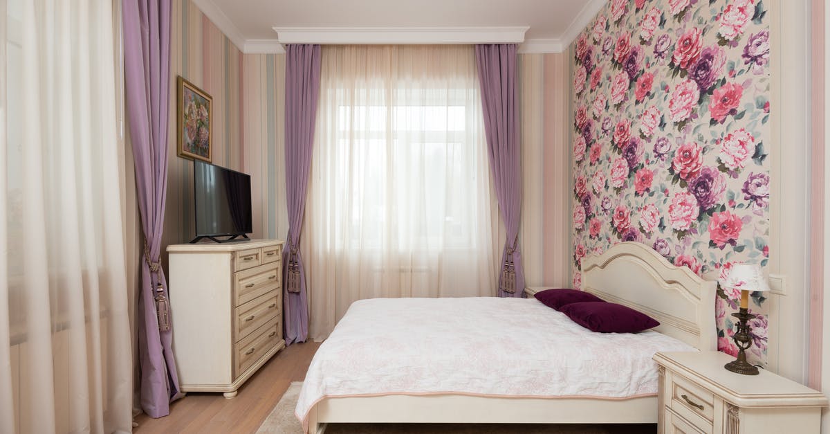 How to /testforblock chest with items and blocks inside [duplicate] - Interior of light bedroom with soft bed in front of chest of drawers with TV near windows with light curtains