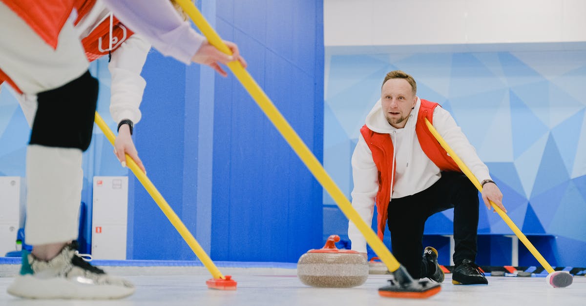 How to throw the crate in Inside on iOS? - Determined sportsman throwing heavy granite curling stone near crop anonymous team sweeping ice sheet with brooms while playing sportive game