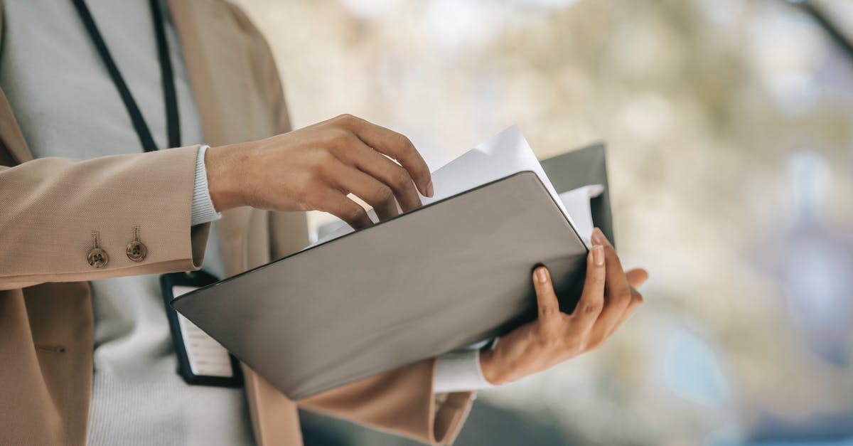 How to turn off a .cfg file? - Crop anonymous female entrepreneur in elegant jacket with badge looking through papers in folder How to turn off a .cfg file? - Crop anonymous female entrepreneur in elegant jacket with badge looking through papers in folder